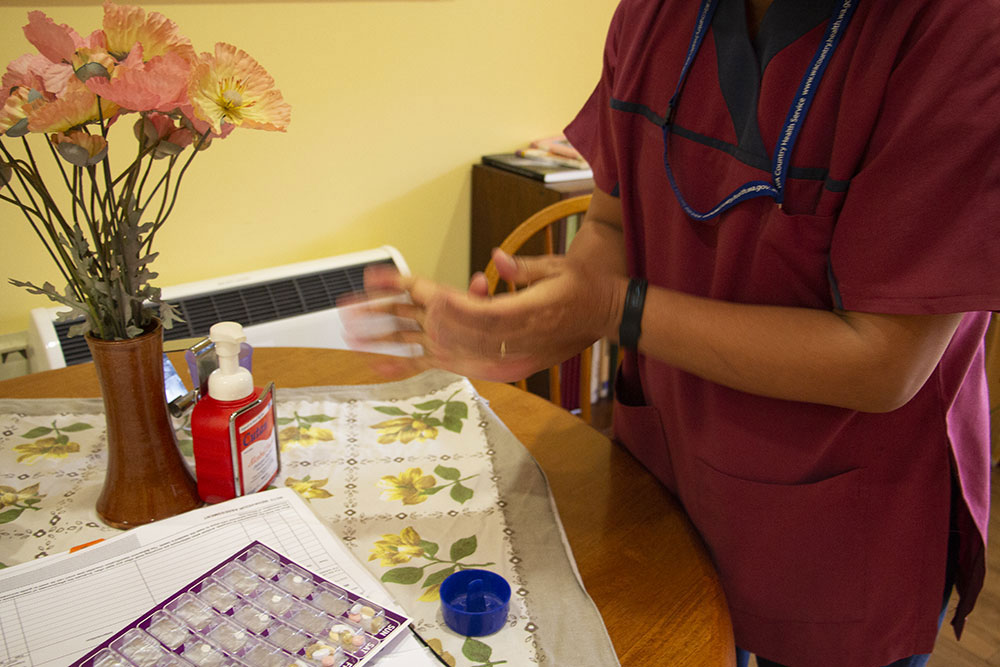 Jamie performing hand hygiene