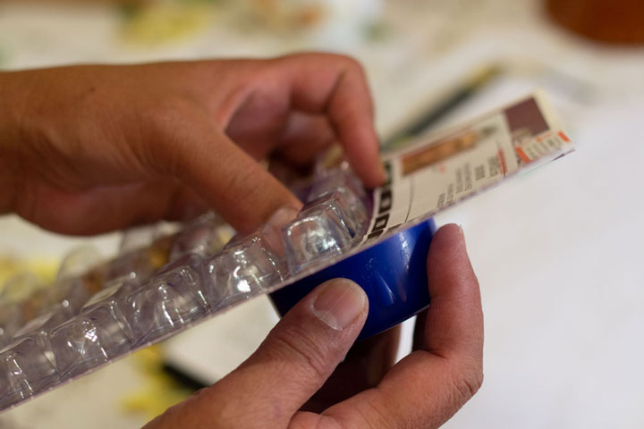 Removing tablets from the blister pack
