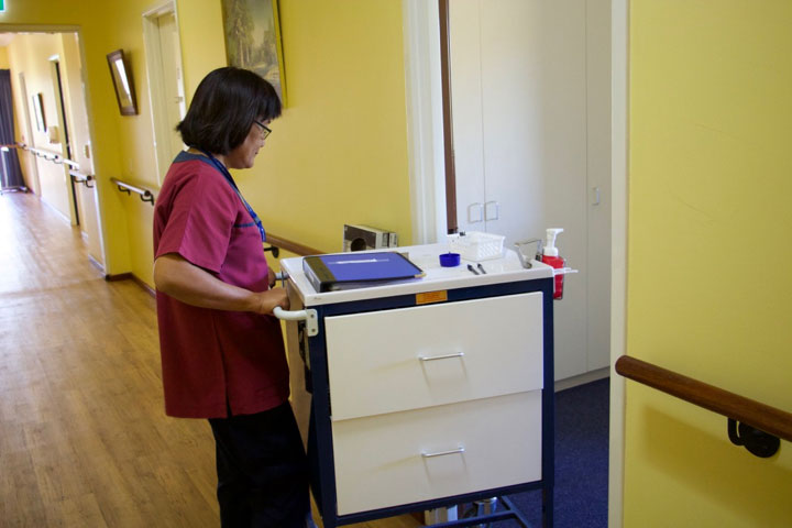 Jamie pushing medication trolley
