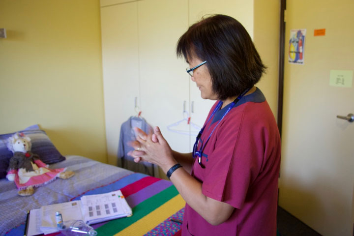 Jamie performing hand hygiene