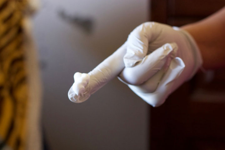 Gloved finger with cream